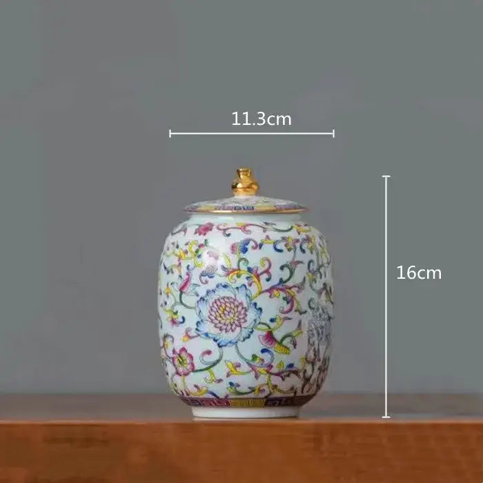 Floral white enamelled porcelain tea caddy ginger jar with multicolored floral patterns and gold-toned lid for dining room