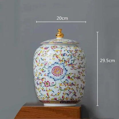 White enamelled porcelain tea caddy ginger jar with multicolored floral patterns and gold-toned lid for dining room use
