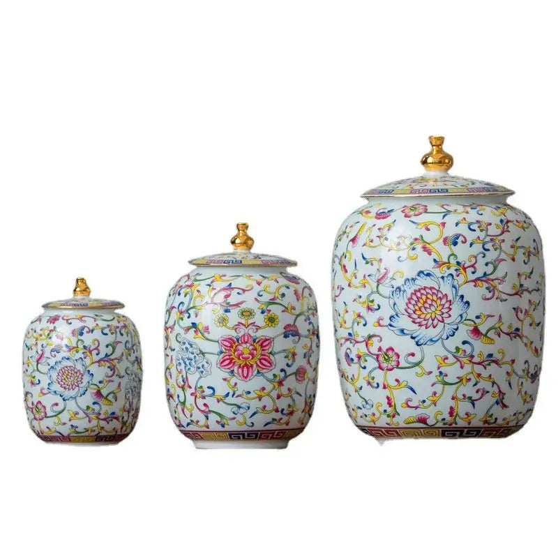 Three floral patterned enamelled porcelain tea caddy ginger jars with gold lids for dining room storage