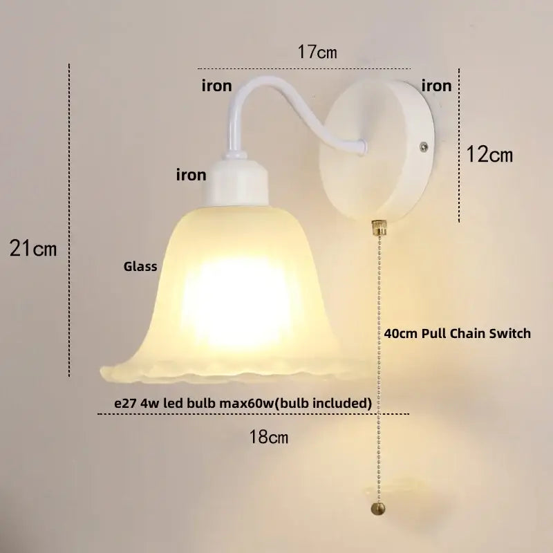 White iron wall sconce with frosted glass bell-shaped shade and 40cm pull chain switch by decorbites glass iron led