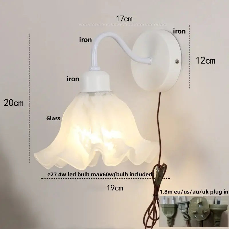 Floral white glass wall sconce with white iron frame and translucent shade featuring a pull chain switch stair light
