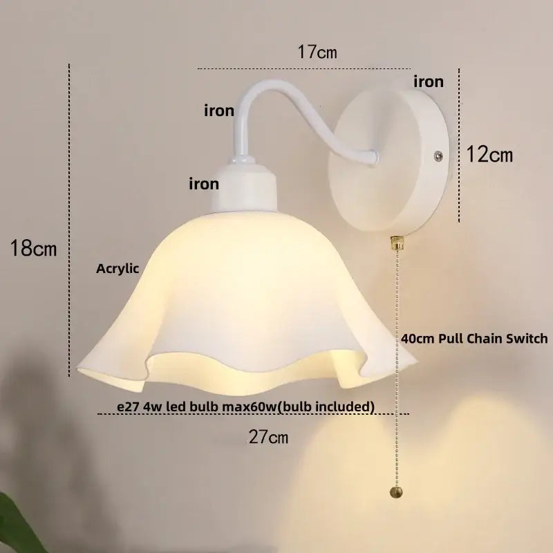 Floral white glass wall sconce with white acrylic lampshade, curved iron arm, and 40cm pull chain switch
