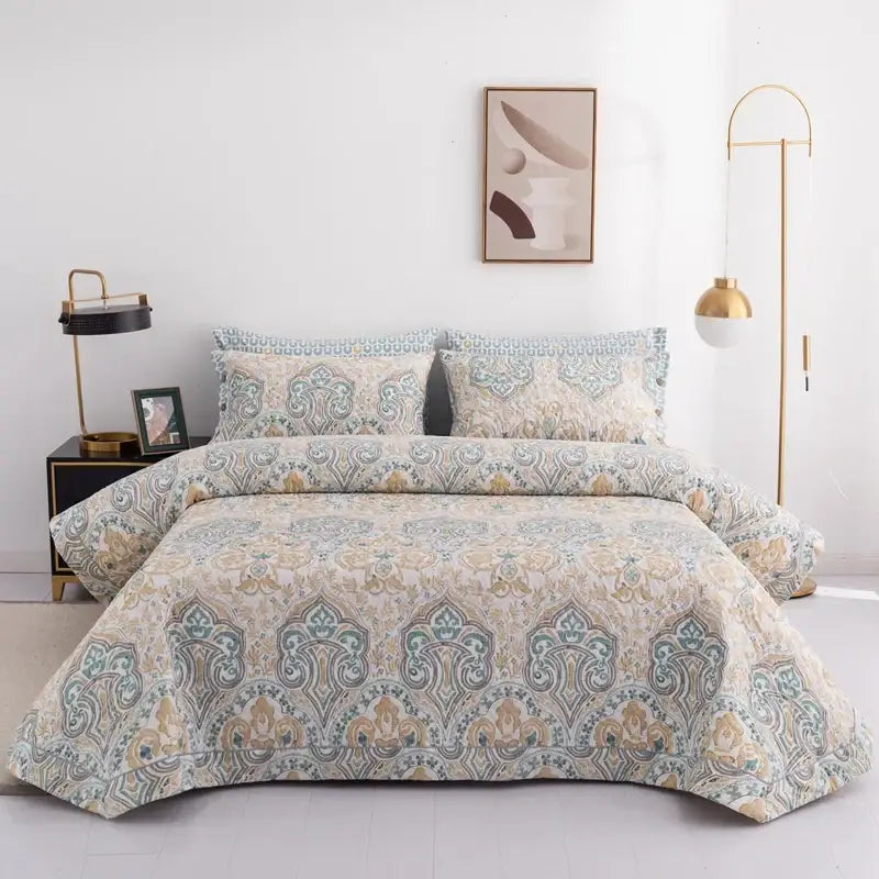 Beige and teal paisley patterned cotton bed cover set with intricate embroidery for a floral white and green bedroom