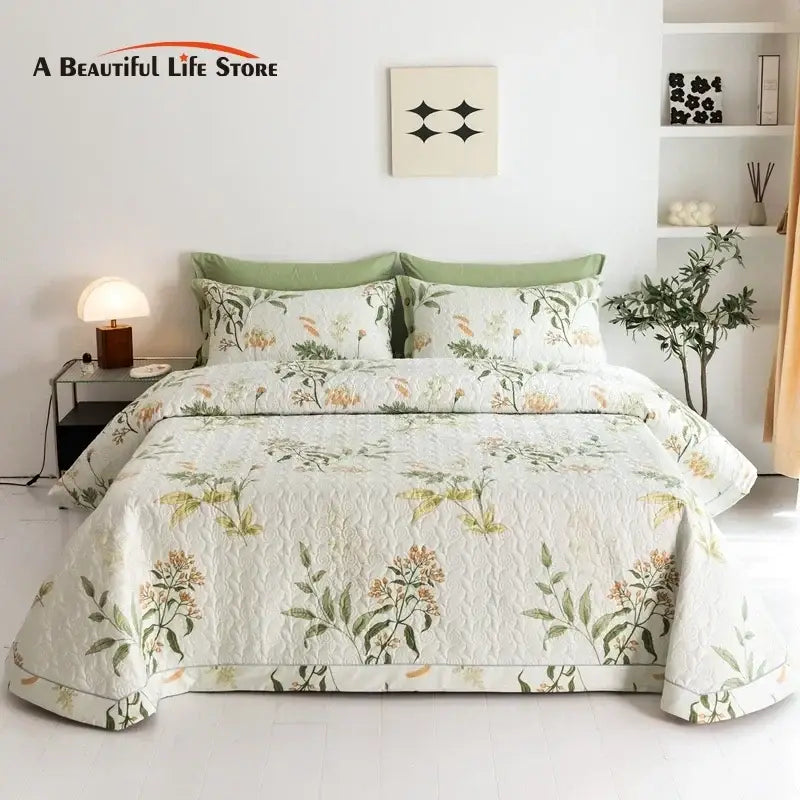 White quilted cotton bed cover set with delicate green and orange floral patterns for bedroom use