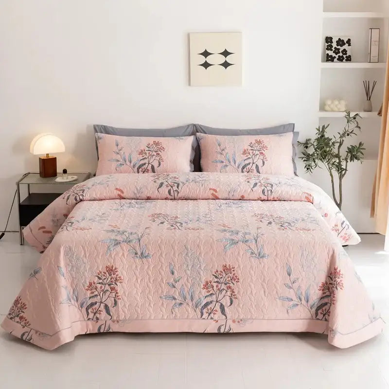 Pink quilted cotton bed cover set with floral embroidery in pink red and blue for bedroom use