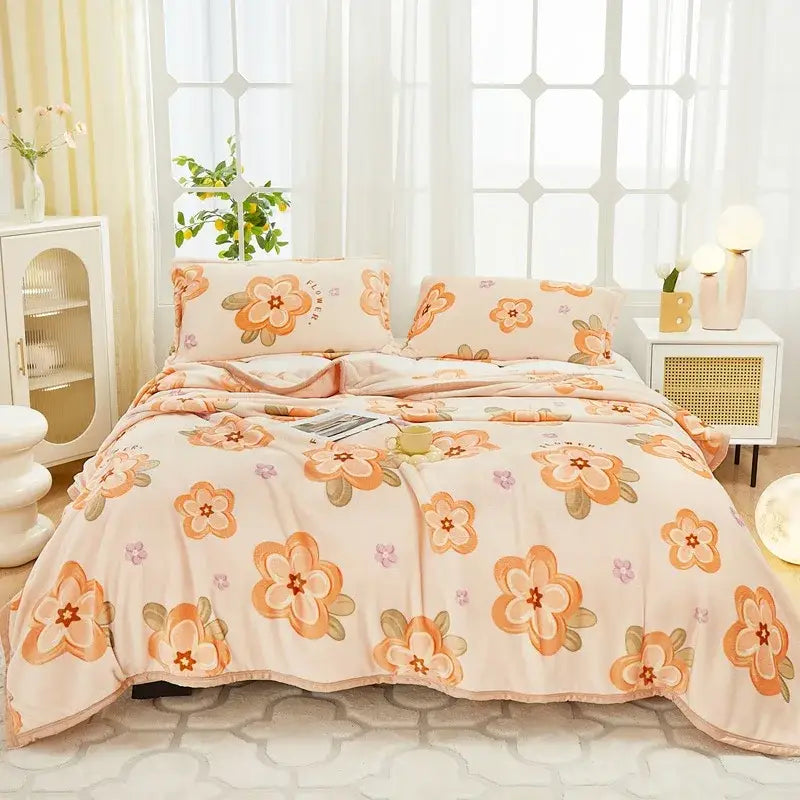Cream-colored floral comforter set with large orange and pink blossoms on cozy flannel plush fabric by decorbites