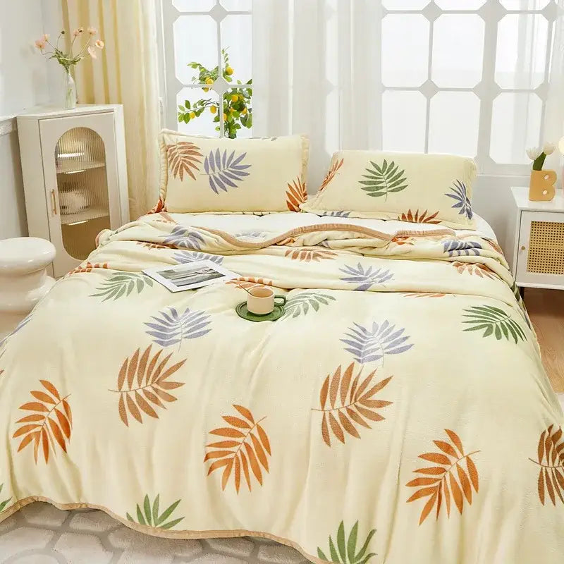 Cream-colored cozy flannel plush blanket with tropical leaf pattern in orange green and purple for bedroom decorbites cozy flannel