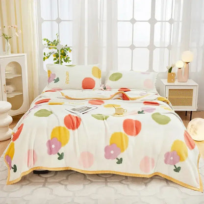 Floral white and navy cozy flannel plush blanket with colorful flower and fruit pattern and soft gold trim decorbites cozy flannel