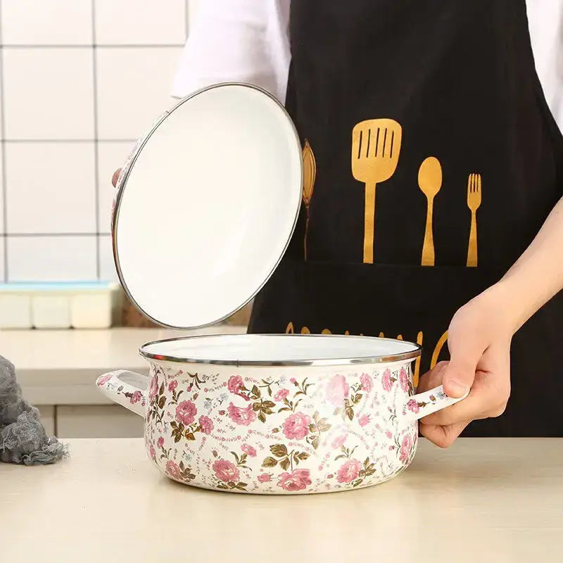 Floral white and pink enamel ceramics soup saucepan with silver rims and two handles for kitchen use