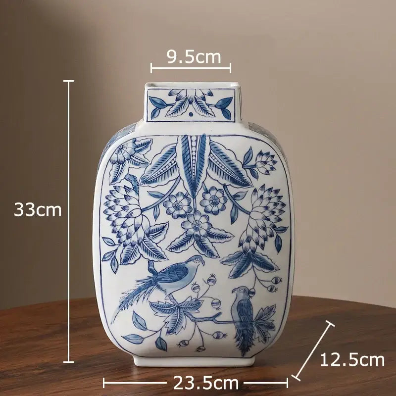 White porcelain vase with intricate blue floral and bird patterns, square neck, rounded body for living room decor