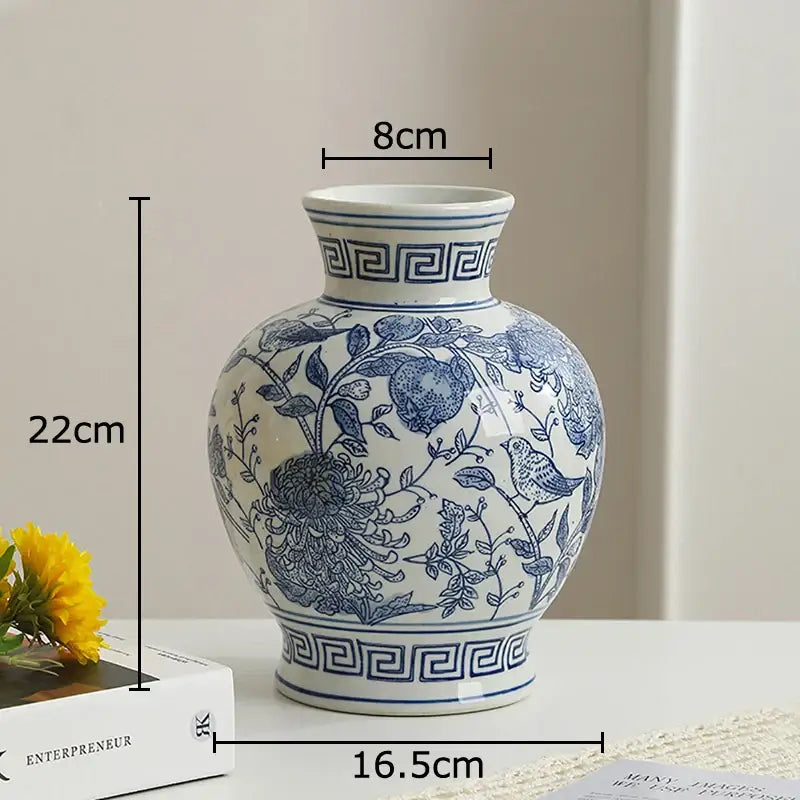 White porcelain vase with blue floral and bird patterns and greek key borders for living room decor
