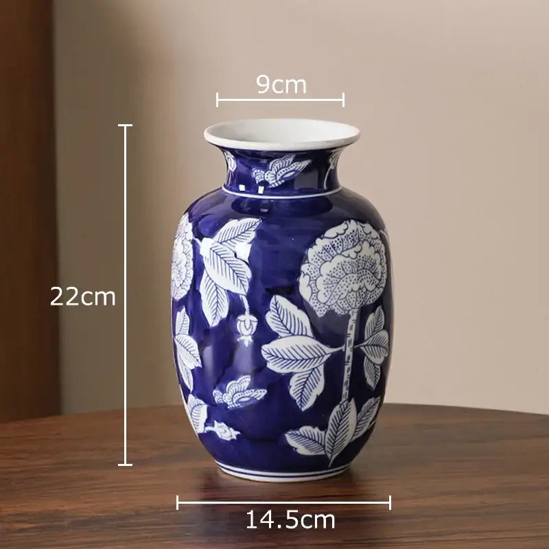 Classic blue and white porcelain vase with intricate floral patterns and glossy finish for living room decor