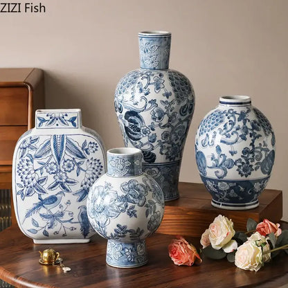Set of four elegant blue and white porcelain vases with floral and bird motifs for living room decor