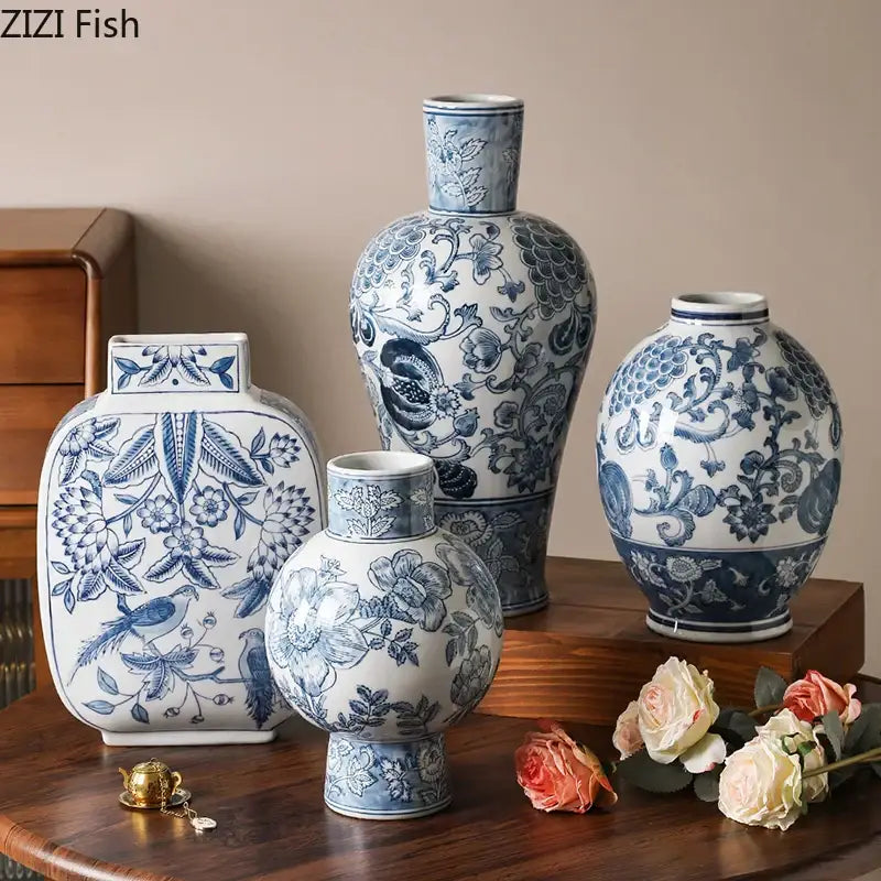 Set of four elegant blue and white porcelain vases with floral and bird motifs for living room decor
