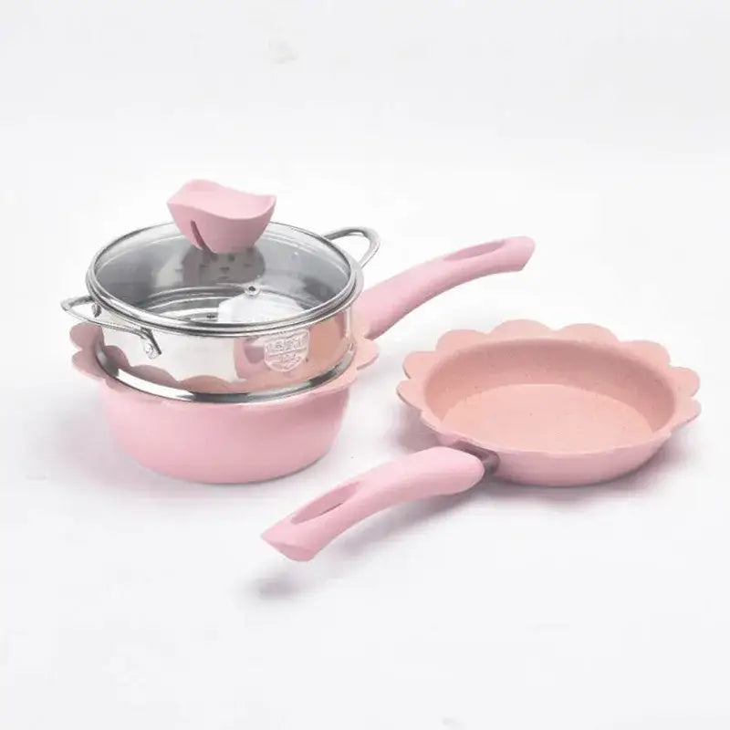 Pink floral-edged baby food pot with matching pink handle and silicone lid knob in kitchen cookware set