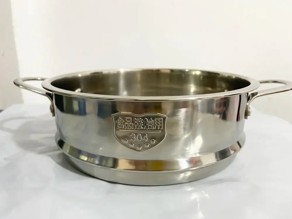 A shiny stainless steel baby food pot with two handles and 304 food-grade stainless steel emblem in a pink and blue set