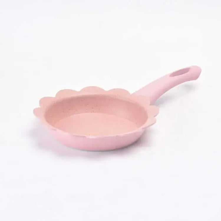 Pink floral-edged nonstick baby food pot with speckled interior and matching handle for kitchen cookware set