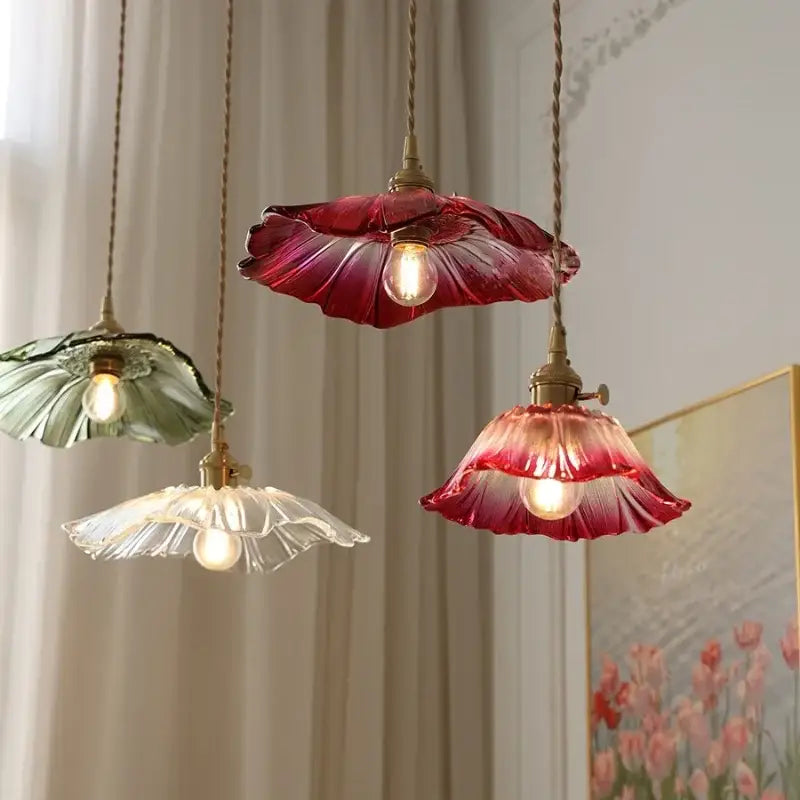 Three hanging pendant lights with petal-shaped red green and clear glass shades and brass finish for kitchen dining decorbites clear glass pendant light