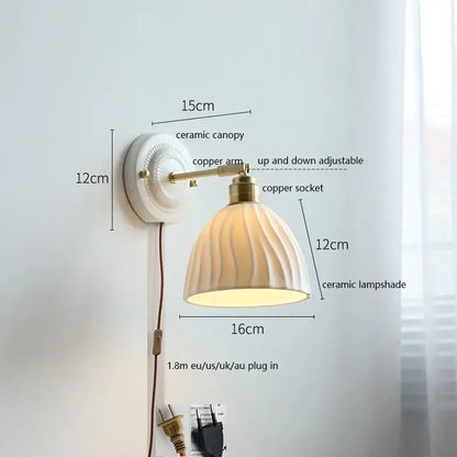 Fluted cream ceramic wall lamp with brass accents featuring a ribbed ceramic shade for bathroom lighting decorbites ceramic wall