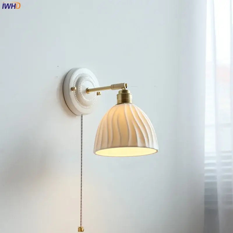 Fluted cream ceramic wall lamp with brass accents by decorbites ideal as a bathroom light and ceramic wall lamp decor