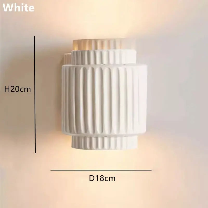 Fluted cream white led wall lamp with vertical ridged texture and tiered cylindrical design for bedroom decorbites decor