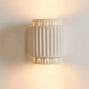 Cream white led wall lamp with fluted ceramic design and warm diffused glow for bedroom decorbites decor
