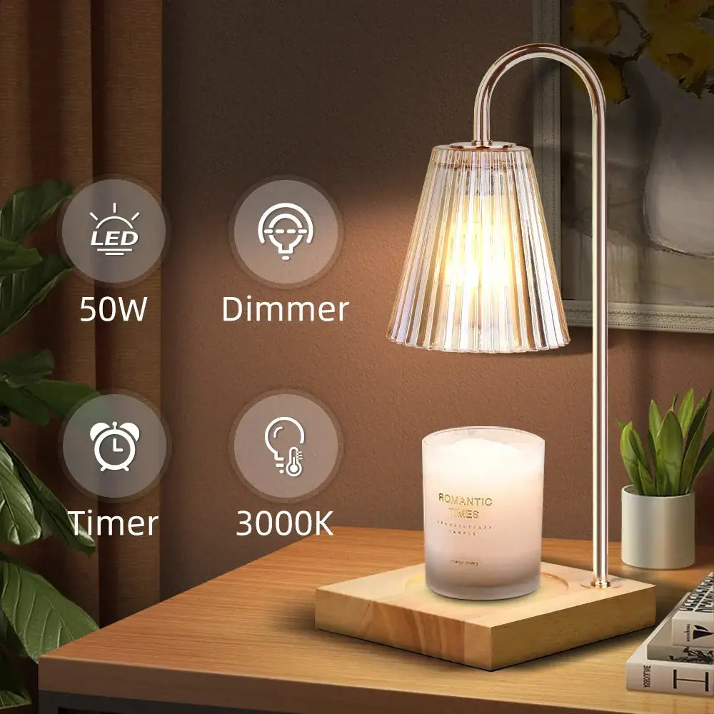 A sleek gold wax melting candle warmer with a curved metallic stand and pleated fluted glass shade for decorbites decor