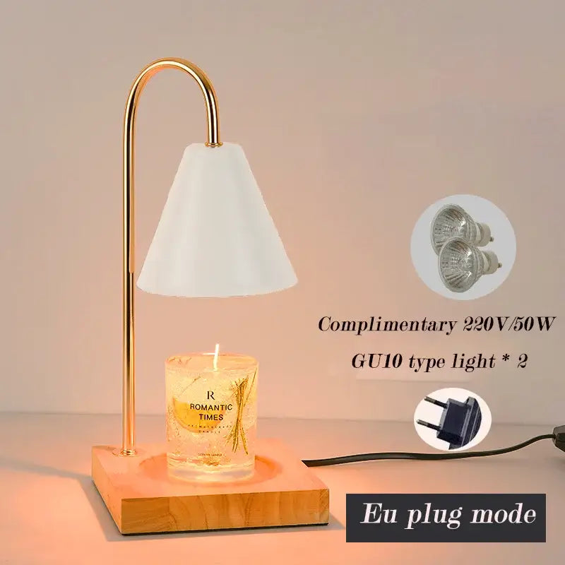 Gold-toned metal candle warmer with white conical shade and wooden base for decorbites gold wax melting in bedroom decor