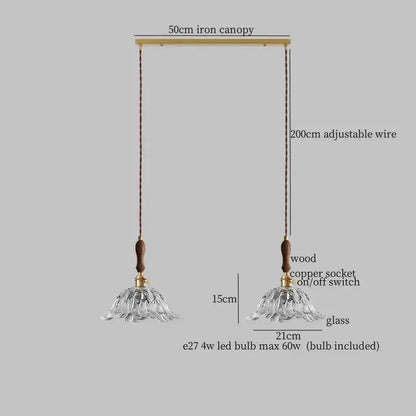 A delicate clear glass led pendant lamp with fluted design and wooden accents for dining room lighting