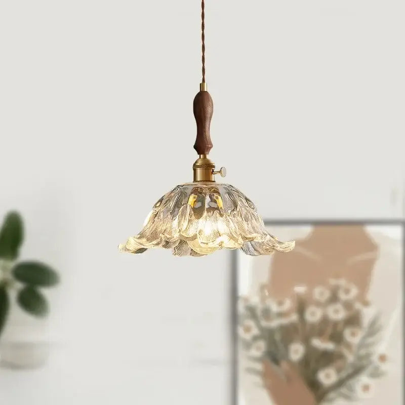 Fluted glass led pendant lamp with translucent petal design and warm brass accents for dining room lighting