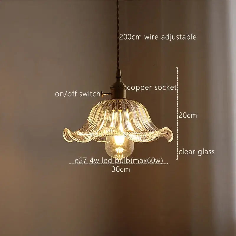 Delicate clear glass pendant light with fluted petal design and exposed bulb for decorbites green stripe kitchen fixture