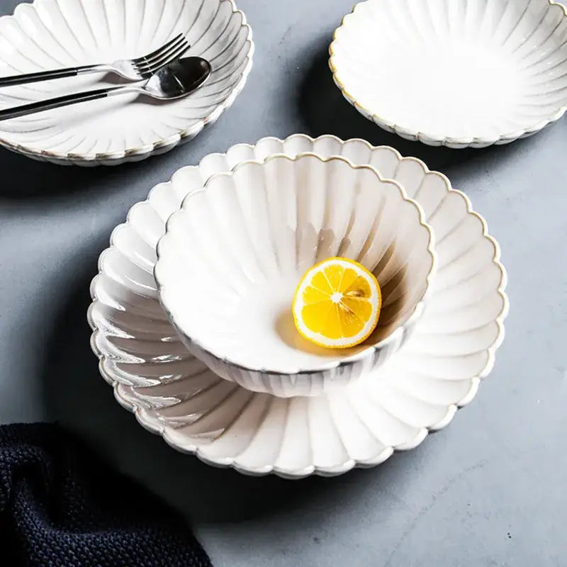 White ceramic bowl with scalloped edges gold rim and fan-like grooves from decorbites ceramic white dinnerware set