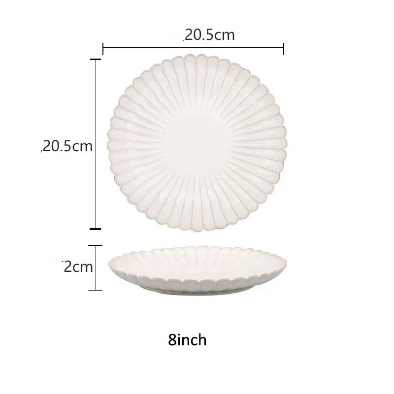 White ceramic plate with scalloped sunburst rim in fluted petal dinnerware set with ceramic white glaze decorbites design