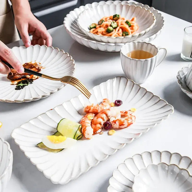 White ceramic dinnerware set plate with fluted petal edge and gold trim featuring decorbites ceramic white glaze