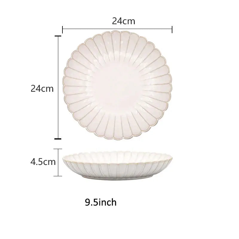 A white ceramic plate with scalloped edge and vertical ridges in the decorbites ceramic white dinnerware set
