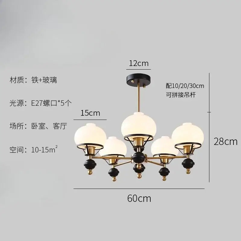 Modern french bauhaus ceiling chandelier with brass and black finish and five frosted glass globes by decorbites