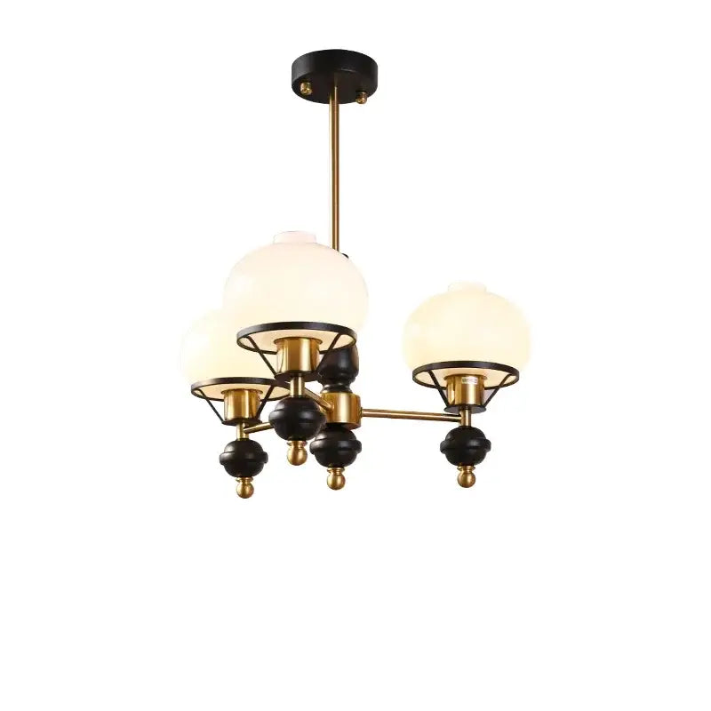 Modern french bauhaus ceiling chandelier with brass and black frame and three frosted glass globe shades by decorbites
