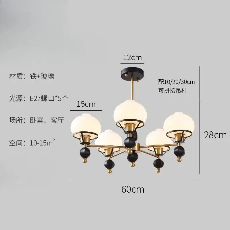 Modern french bauhaus ceiling chandelier with brass and black iron frame and five frosted glass globe shades by decorbites