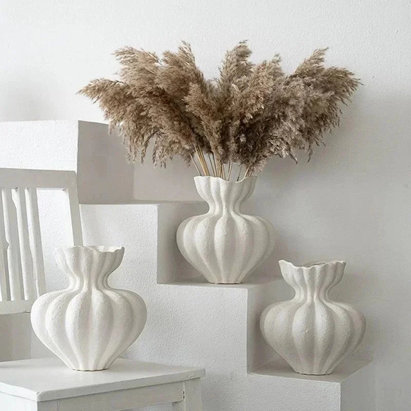 White ceramic fluted vases with ribbed surfaces and scalloped rims french minimalist floral table centerpiece