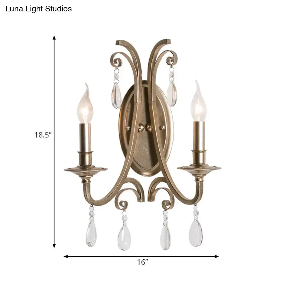 Antique brass finish two-light sconce light with crystal teardrop accents wall lamp for bedroom decor