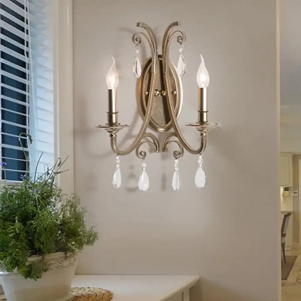 Antique brass finish two-light sconce light with crystal teardrop pendants elegant french country wall lamp