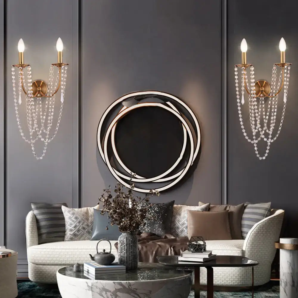 Gold-toned brushed brass wall lamp with clear crystal beads french country chandelier-style bedroom sconce