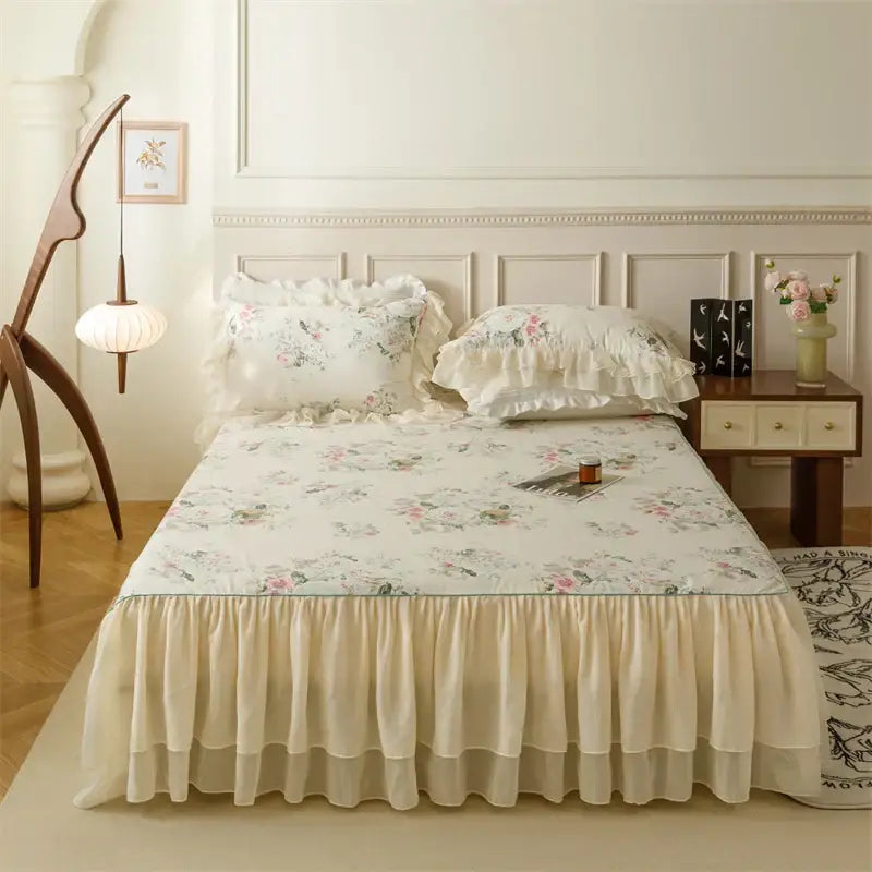 Cream-colored floral bedding set with ruffled edges and layered skirt decorbites french country flowers design