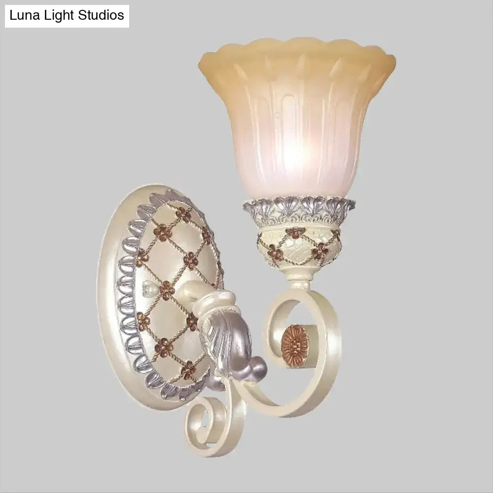 Cream-colored French country wall sconce with ornate silver bronze accents and fluted opaline glass shade for living room gold light