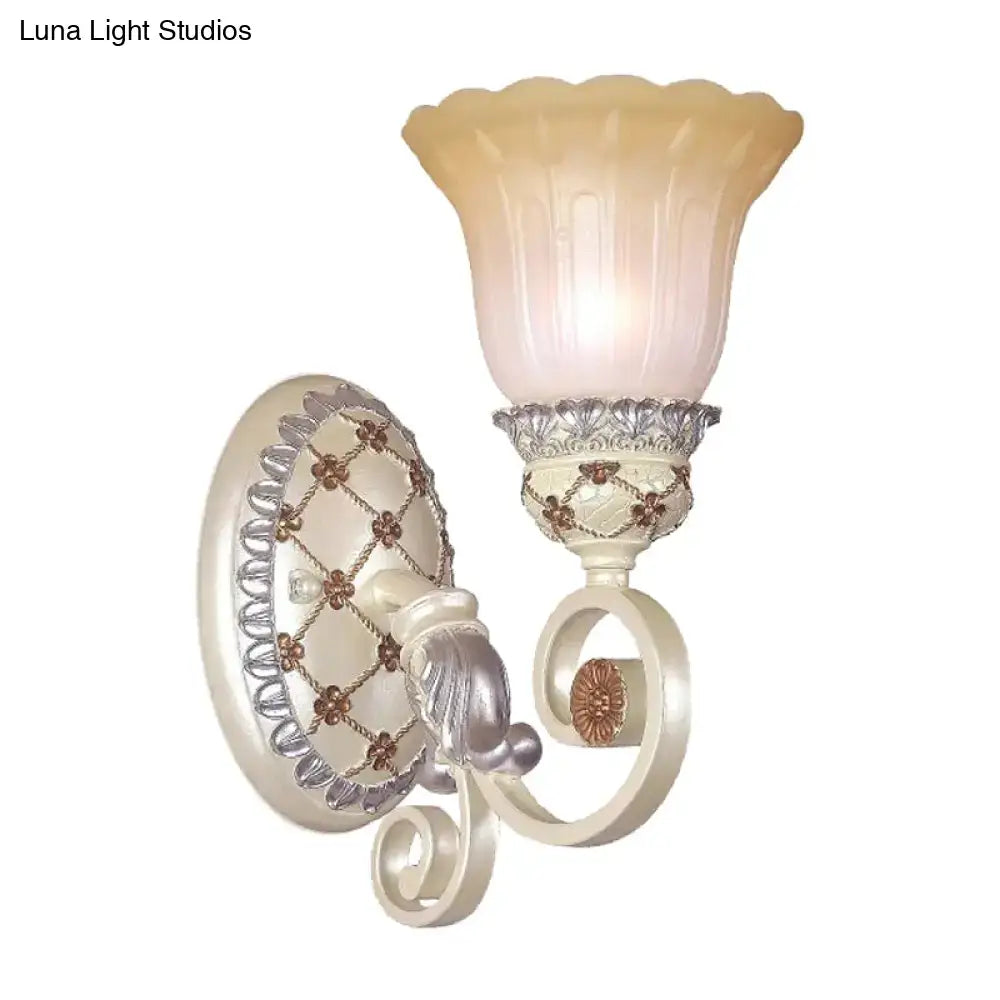 Cream-colored French country wall sconce with gold light metalwork and opaline glass shade for living room decor