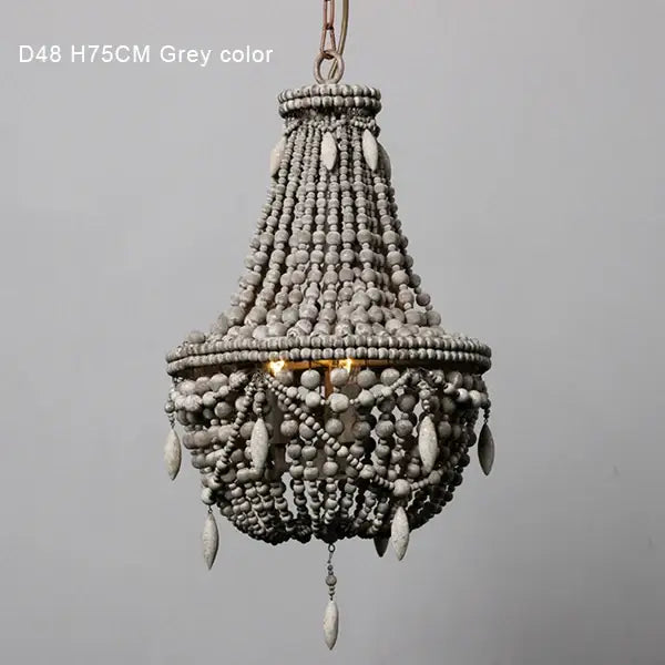 Grey french country wood bead chandelier with tiered design and teardrop ornaments for bedroom or dining room