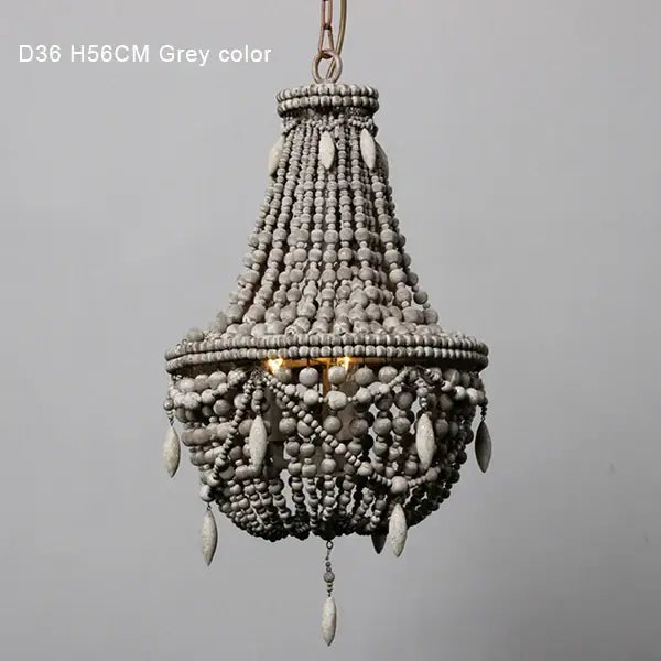 Grey french country wood bead chandelier with tiered design and teardrop-shaped beads for bedroom or dining room