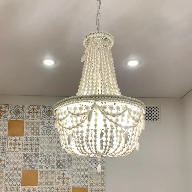 French country wood bead chandelier in white with cascading crystal spheres for bedroom or dining room decor