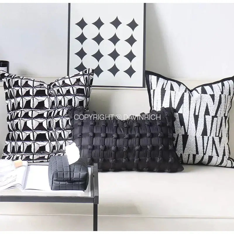 Black quilted cushion cover with woven texture and pom-pom accents for decorbites french cream bubble living room decor