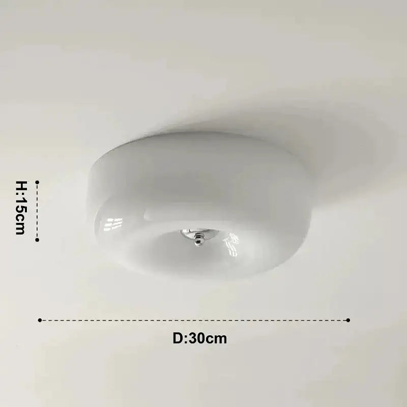 A sleek french cream ceiling lamp with a smooth glass dome and chrome hardware for bedroom decorbites french cream lighting